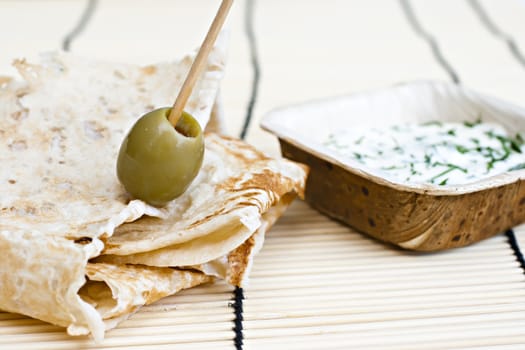 wheat bread with olive and dip.