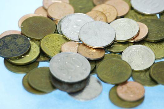 Korean won coins in cyan background with shallow dof