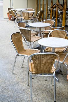 Image of tables and chairs at a cafe.