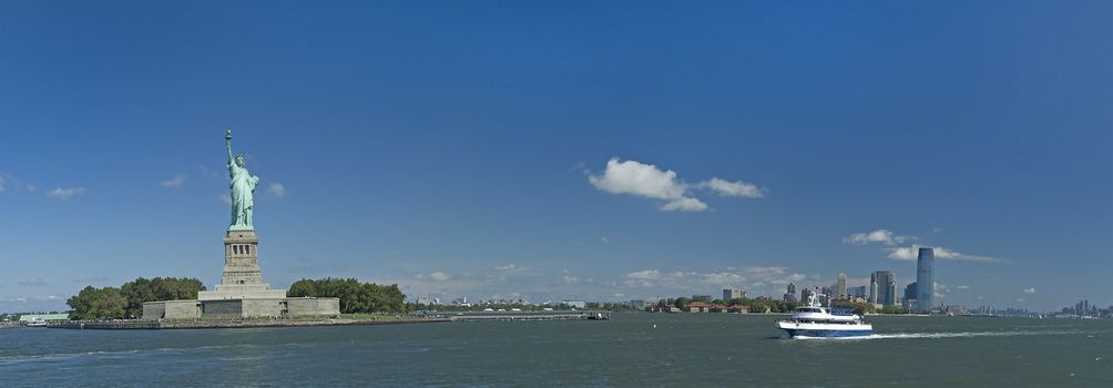 statue of liberty panorama photo, ferry from manhattan, nice summer day