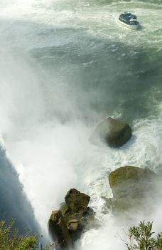 horseshoe falls at niagara waterfalls, attraction boat in distance,