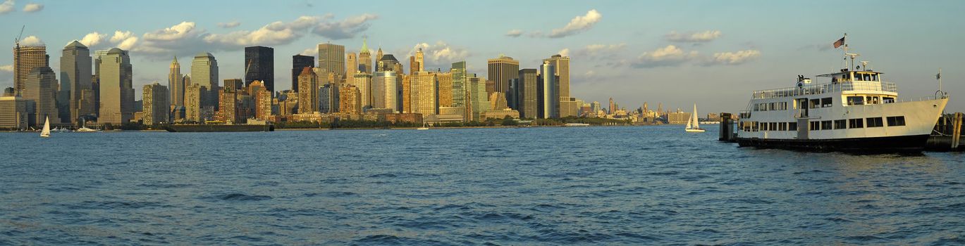 lower manhattan panorama photo taken from new jersey, white boat docking on left