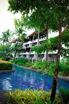 Swimming pool area at a tropical resort in Thailand - travel and tourism.