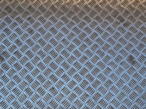 Diamond steel plate useful as a background