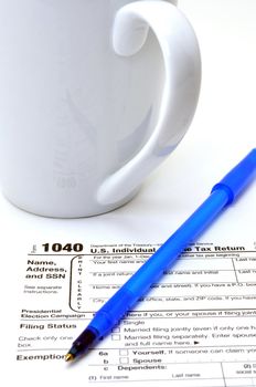 Closeup of IRS form 1040 on white background.