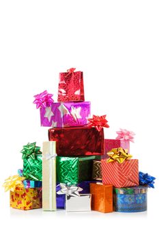 Stack of colorful gift boxes with real reflection isolated over white background