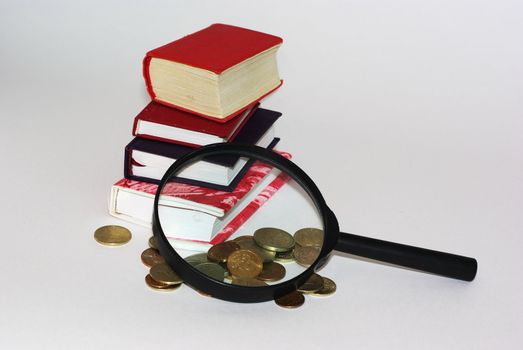 Mini books,coins and magnifier close up