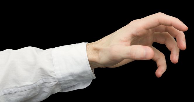 Greedy hand with crooked fingers on a black background
