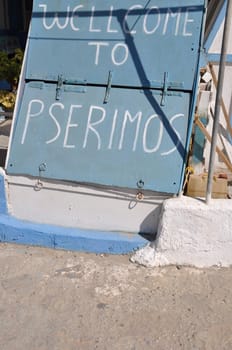 lovely white and blue welcome to Pserimos island placard, Greece