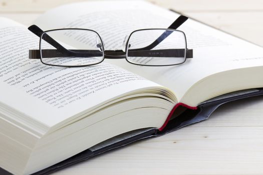 opened book and glasses