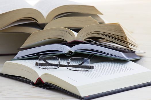 opened books and glasses