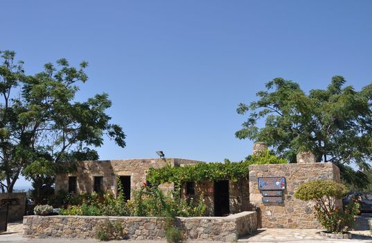 typical greek stone house with lovely garden in Antimahia (Kos), Greece