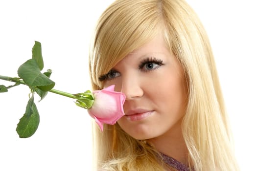 The beautiful girl with a flowing hair and a rose