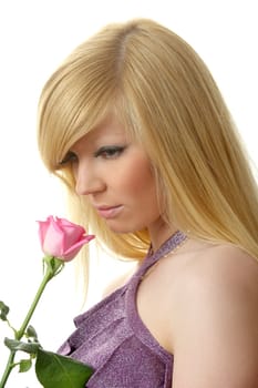 The beautiful girl with a flowing hair and a rose
