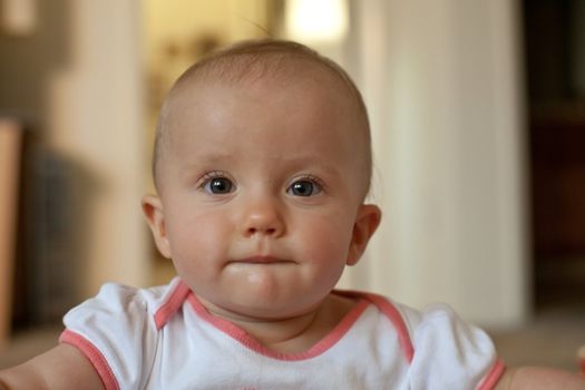 Portrait of cute little caucasian baby girl.