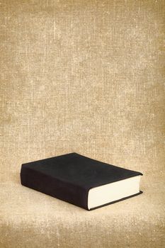 The black book on the fabric background