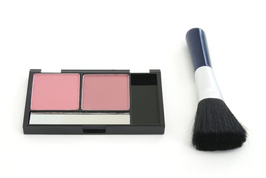A two tone blush makeup set with an applicator brush.