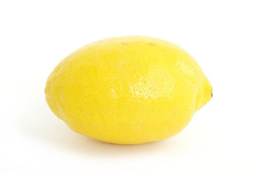 A fresh whole lemon on white background.