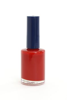 An isolated bottle of red nail polish.