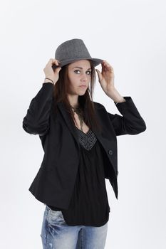 young brunette with greay hat looking at the camera