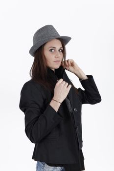 young brunette with greay hat looking at the camera