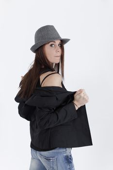 young brunette with greay hat looking at the camera