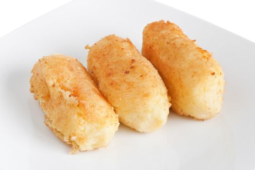 dish with potato croquettes isolated on white background with clipping path