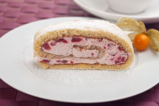 slice of a jelly roll cake on a white plate