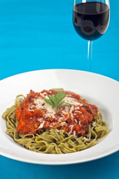 tagliatelle with sauce bolognaise in white plates