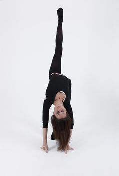 Young gymnast in black looking at the camera