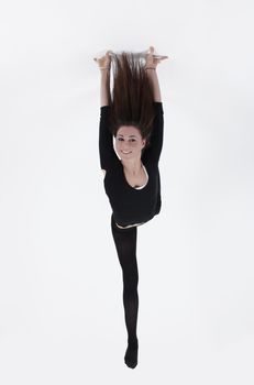 Young gymnast in black looking at the camera