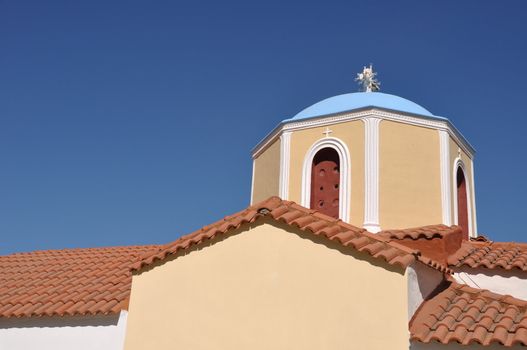 typical greek church in Zia village (Kos island), Greece (gorgeous blue sky)