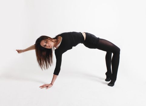 Young gymnast in black looking at the camera