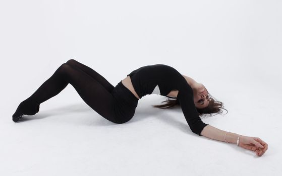 Young gymnast in black looking at the camera