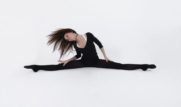 Young gymnast in black looking at the camera