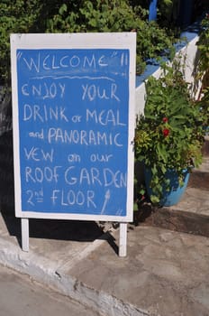 blue restaurant ad invinting tourists in Zia (Kos island), Greece