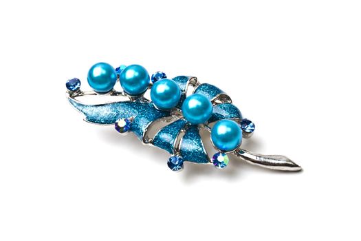 Beautiful blue brooch isolated on white background