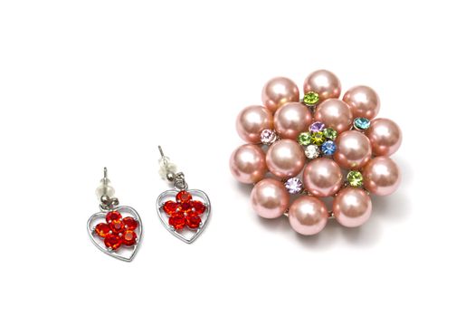 Beautiful pink brooch isolated on white background 
