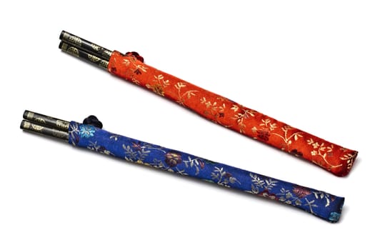 Two set of chopsticks isolated on white background 
