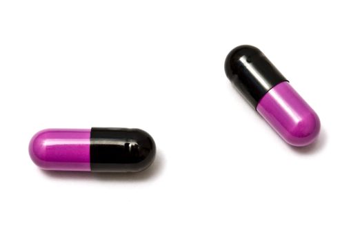 Two capsules isolated on white background