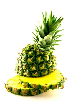 fresh delicious looking green pineapple fruit on a white background with a clipping path