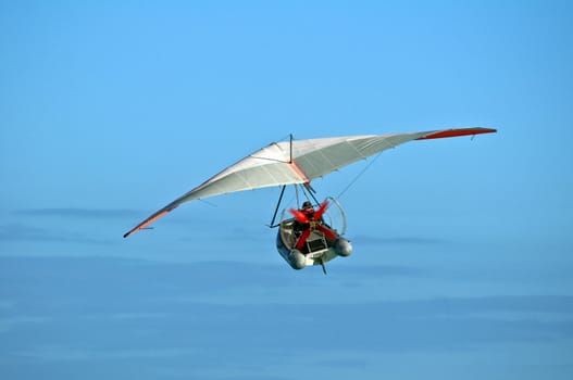 Hang glider boat flying over the Caribbean.