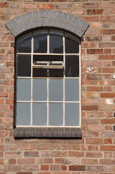 vintage wooden window on a brick wall building 