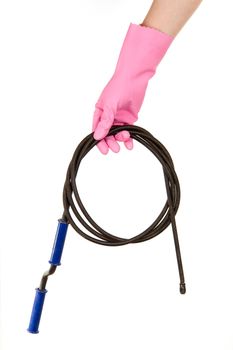 Female hand in a pink glove keeps a hawser for the water drain, isolated, on a white background
