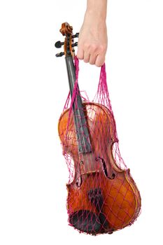 Female hand holding a red mesh with the violin, isolated, on a white background