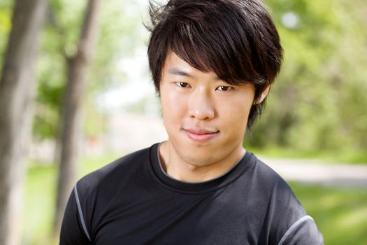 Portrait of a man smiling against blur background