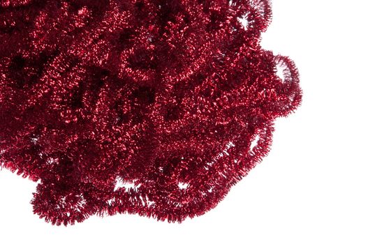 red Christmas tinsel decorations isolated on white background (copy-space available)