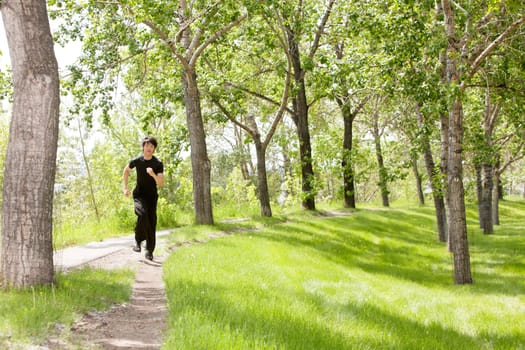 Portrait of handsome man running in speed