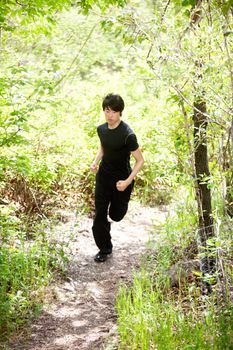 Man jogging during morning walk against blur background