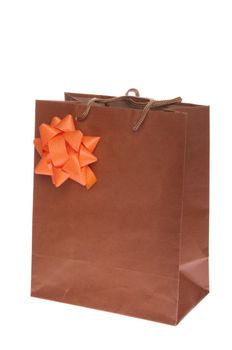 brown gift paper bag with orange bow isolated on white background